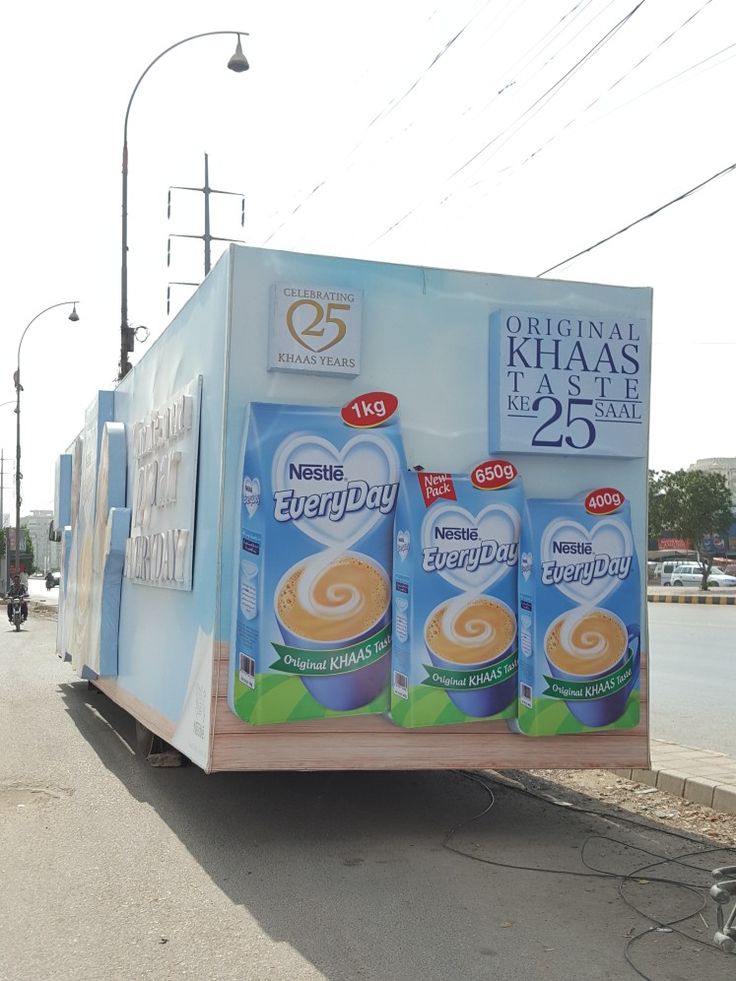 Digital SMD screen displaying vibrant outdoor advertising in a busy area of Pakistan.