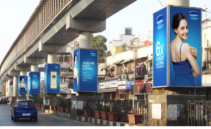 OOH marketing billboard at a busy traffic signal planned by an advertising agency Lahore