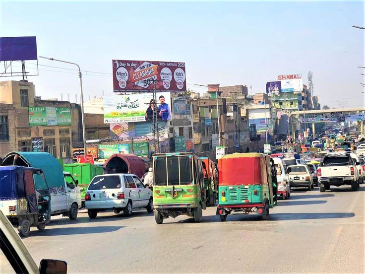 Model Town Lahore Punjab Pakistan billboard with busy traffic on Link Road
