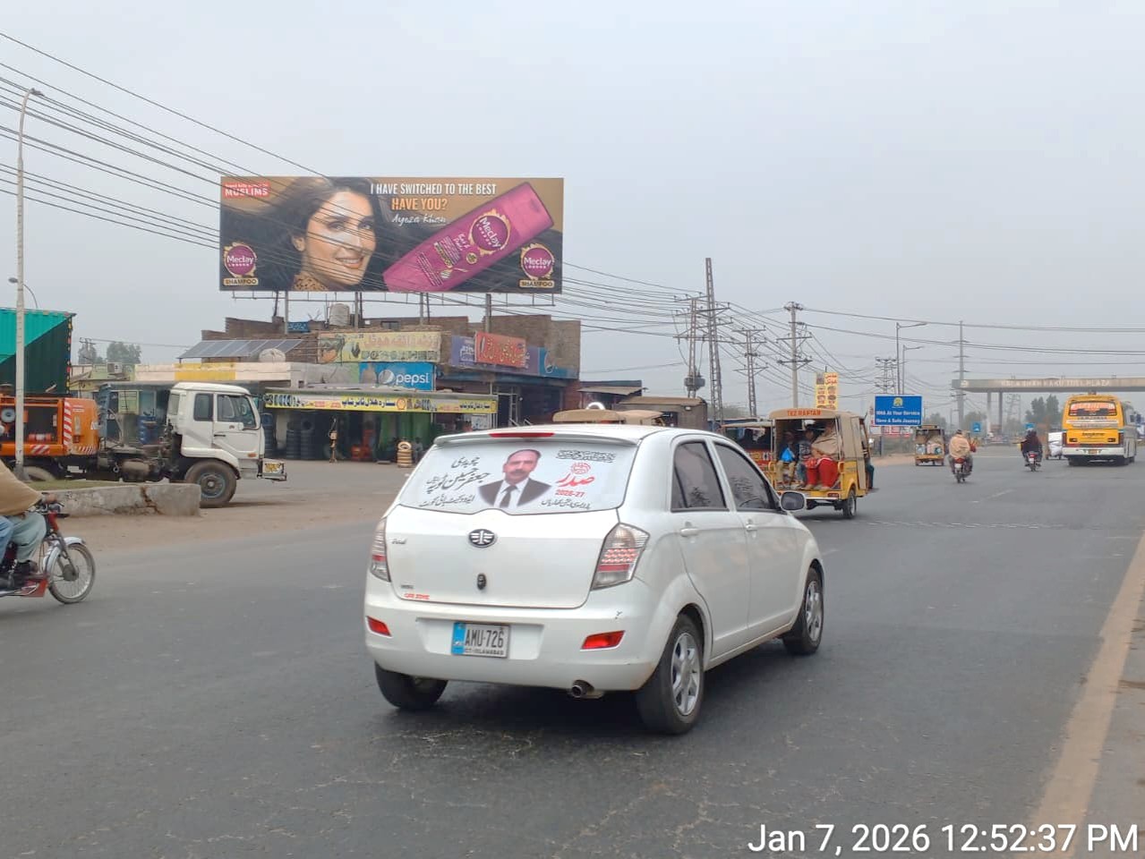 Billboard At Kala Shah Kaku Toll Plaza GT Road Lahore with heavy traffic